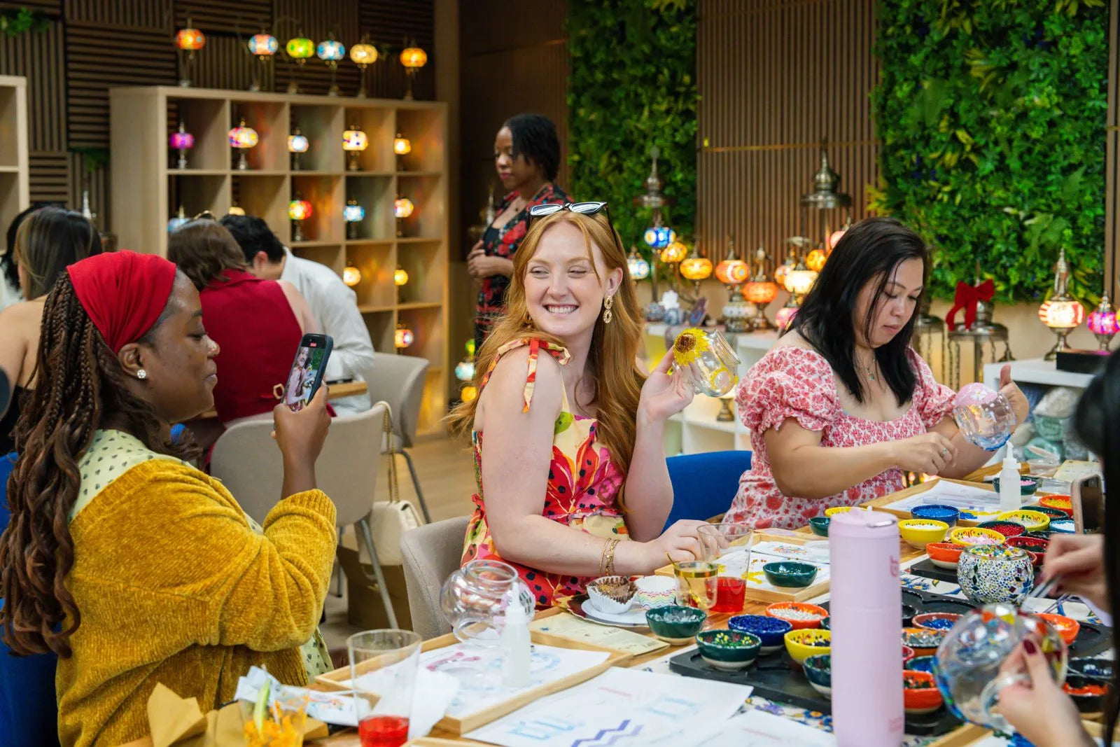 A table full of people making something together.